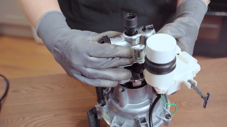 Slot the pump on top of the motor.