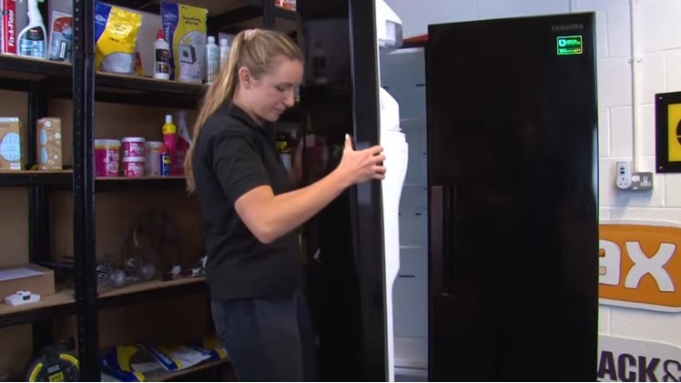 Fully Removing The Freezer Door By Carefully Lifting It Straight Up