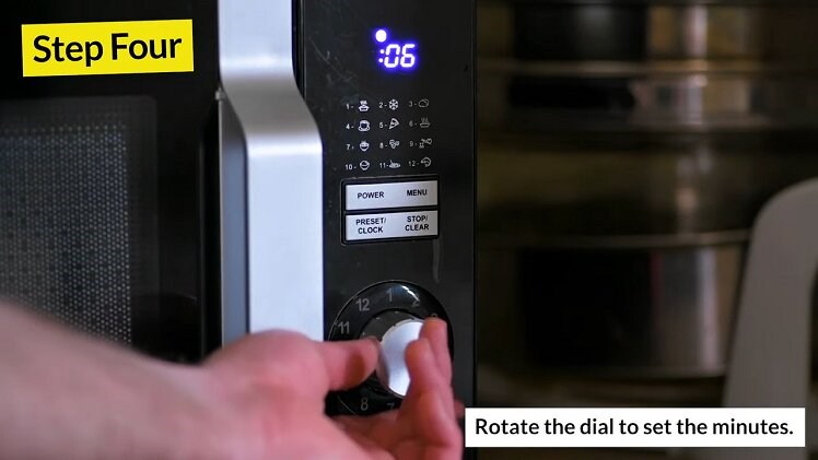 Rotating The Dial On The Sharp Microwave To Change The Minutes