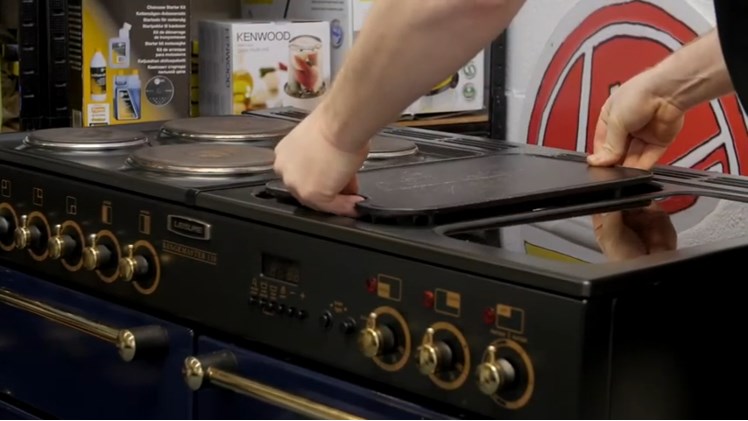 Refitting The Griddle Cover At The Top Of The Cooker