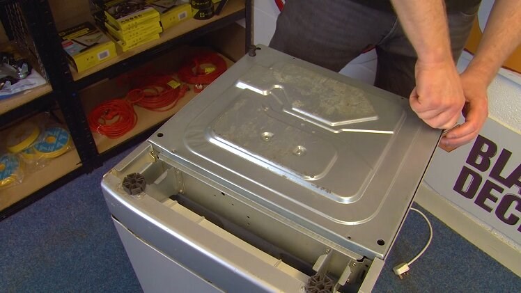 Screw the two rear feet back in place on the dishwasher's bottom panel