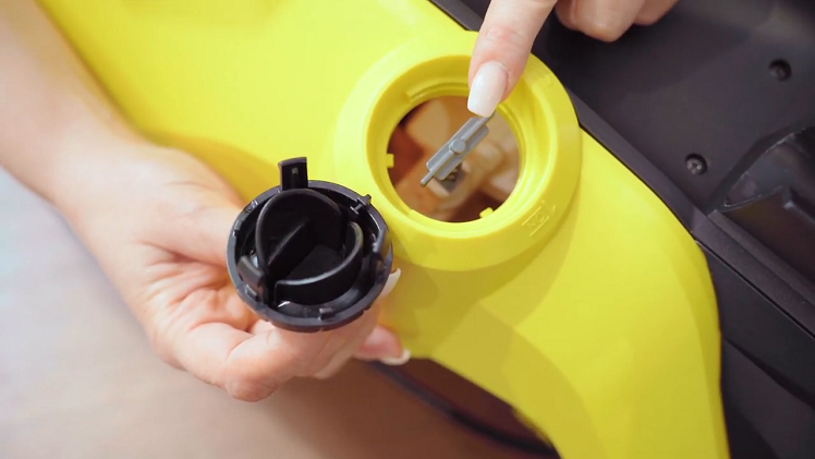You should see the control switch through the control knob opening.