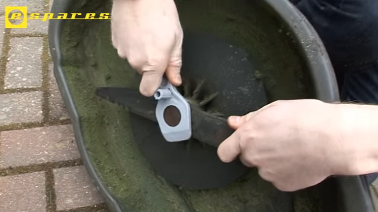 Using The Special Flymo Nut Tool To Remove The Blade Holding Nut