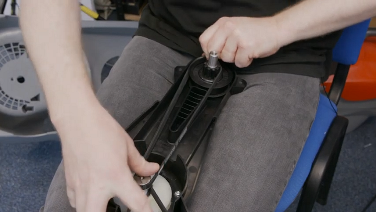 Refitting The Impeller Belt By Placing It Around The Central Shaft Above The Blade Belt And Then Working It Around The Opposing Wheel