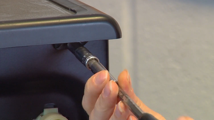 Using your 7mm socket, unscrew the three nuts that hold the top panel in place.