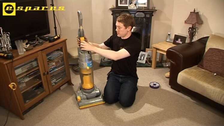 Return the bin canister back onto the vacuum cleaner, clicking it into place and making sure it's secure