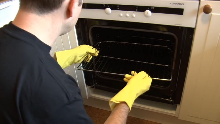 Refitting The Oven Shelves Back Inside The Oven