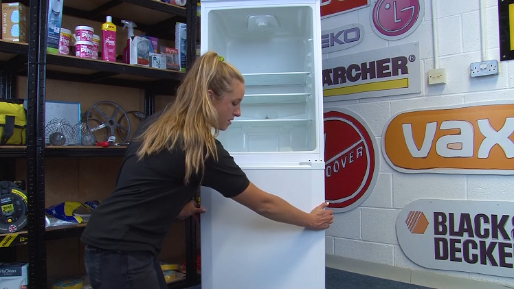 Removing The Freezer Door By Holding It On Both Sides, Opening It Slightly And Lifting It Off Of The Bottom Hinge