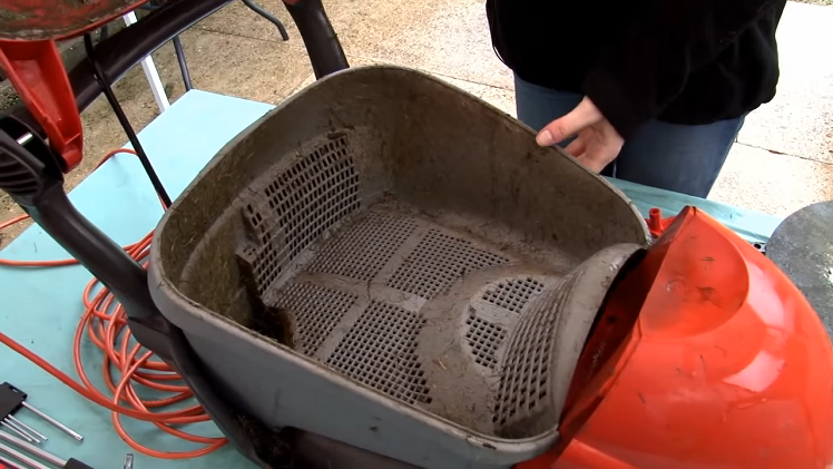 Removing The Grass Collection Box From Inside The Lawnmower