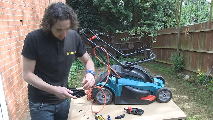 Lifting The Lawnmower Switch And All Of The Connected Cables Out Of The Housing Entirely