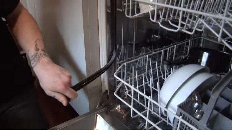 Pulling The End Of The Dishwasher Door Seal Out The Bottom Of The Door Frame