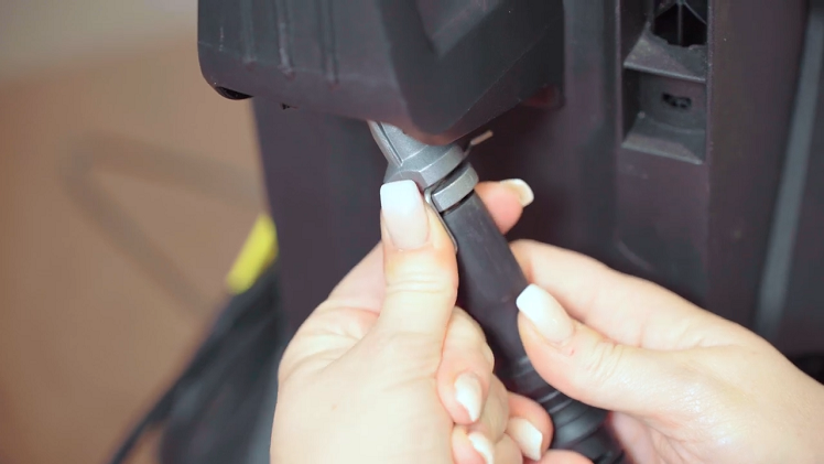 Secure the connection hose by slotting the clip into place at the back
