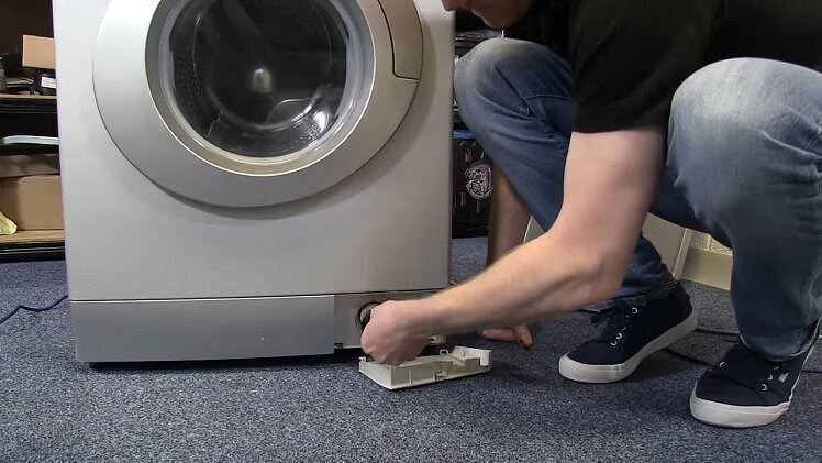 Removing The Small Filter Panel At The Bottom Of The Washing Machine