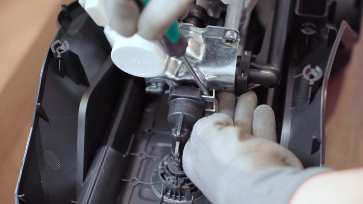 To remove the motor, use a flatblade screwdriver to remove the clip that holds the motor unit in place at the top.