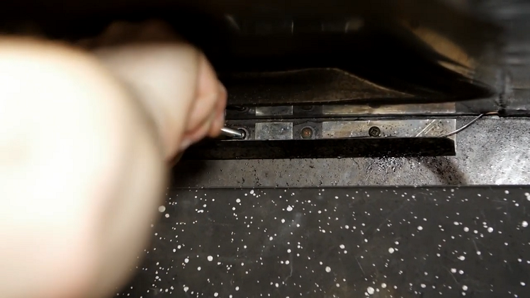Securing The New Capillary By Screwing Its Clips Into Place At The Back Of The Oven