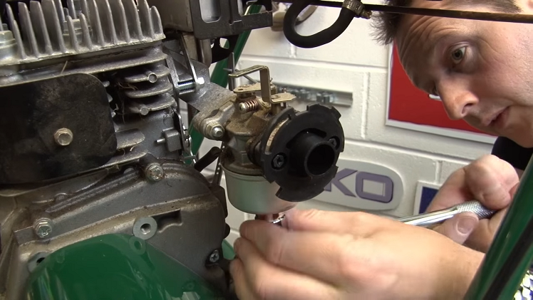 Removing The Nut From The Carburettor Using A Socket