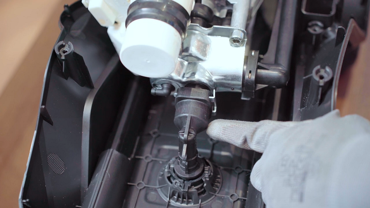 If your Karcher pressure washer is leaking from the top of the water outlet, you will need to remove the motor from the inside of the pressure washer to fix it.