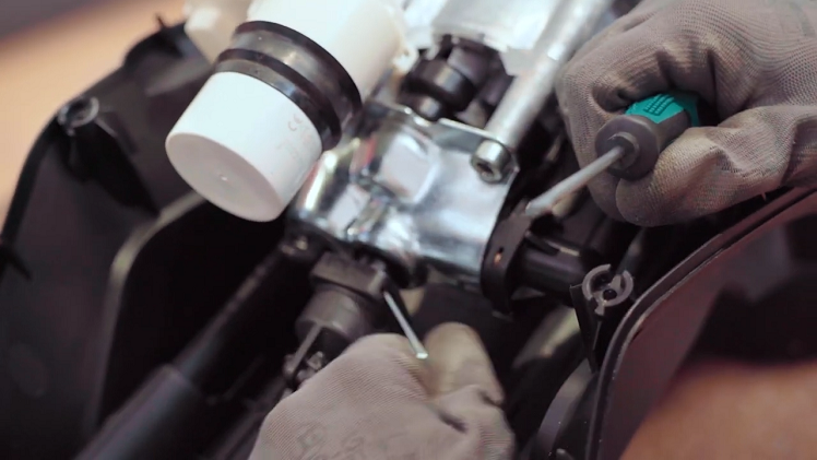 Once you've pried the clip out enough, you should be able to grab hold of it and finish pulling it out by hand.