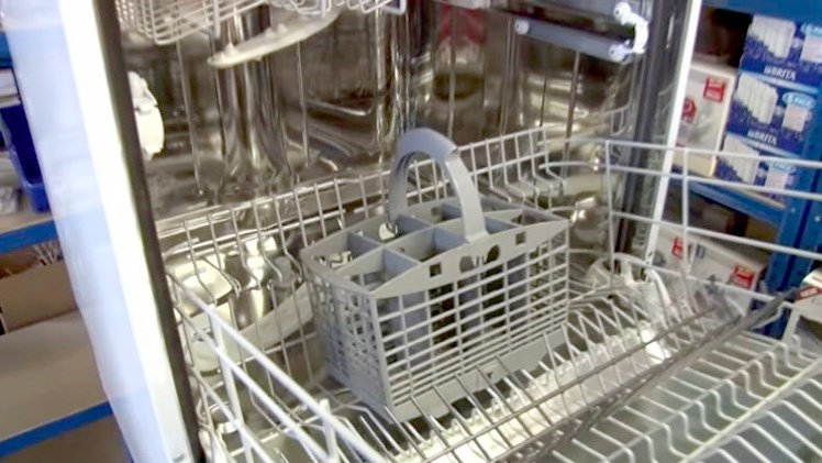 A cutlery basket placed on the dishwasher basket