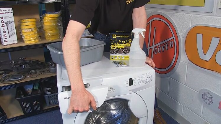 Slotting The Washing Machine Detergent Drawer Back Into Its Housing