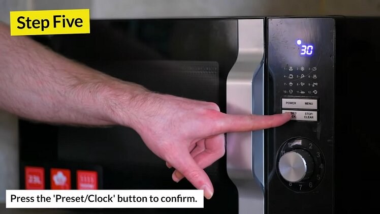 Pressing The Preset/Clock Button On The Sharp Microwave To Confirm And Set The Minutes On The Clock