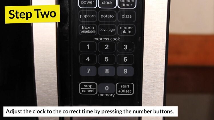Adjust the clock to the correct time by pressing the number buttons on the control panel