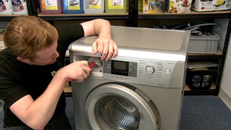 Giving The Washing Machine Detergent Dispenser Jets A Clean With A Brush