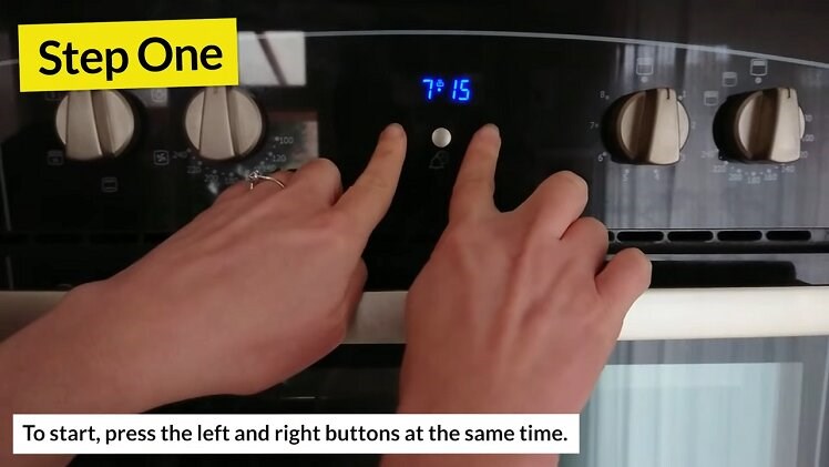 Pressing The Left And Right Buttons Beneath The Belling Oven Clock At The Same Time