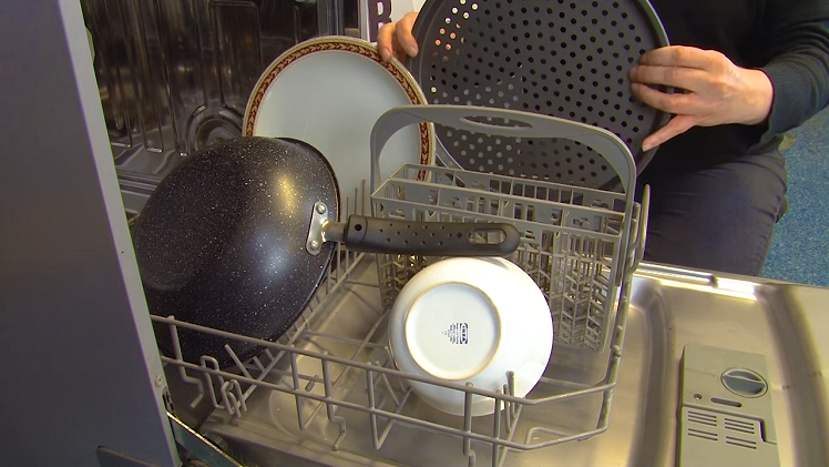 A Tray Placed Around The Edge Of The Dishwasher Lower Basket