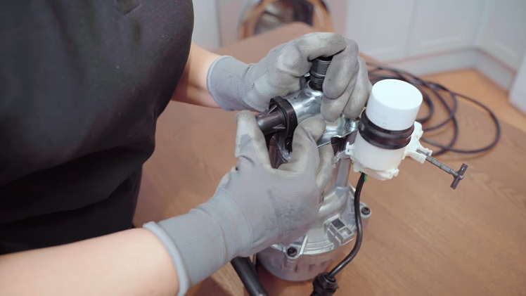 Twist it into place and push the larger top end firmly into the pump cylinder head opening.