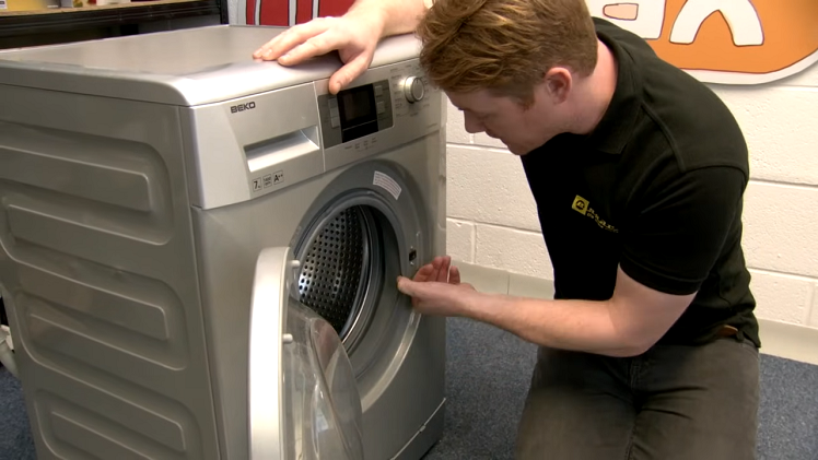 Check the outer lip of the washing machine door seal all the way around for any rips or tears
