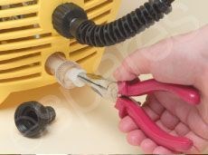 Removing The Pressure Washer Inlet Filter With A Pair Of Pliers