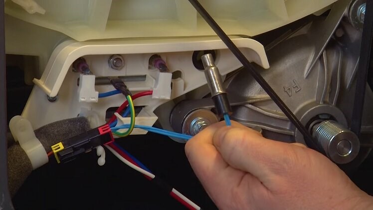 Gently pull the thermostat out of its slot by its wire connection
