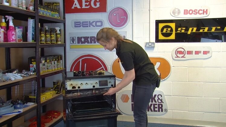 Slide the control panel across and then lift it away from the oven