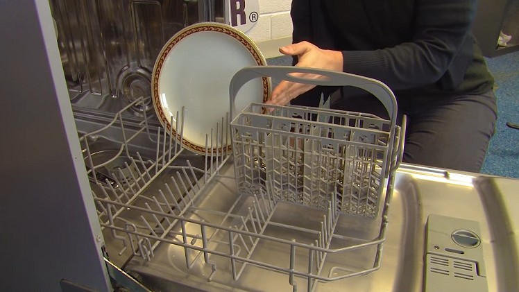 A Plate Facing Inwards On The Dishwasher Lower Basket