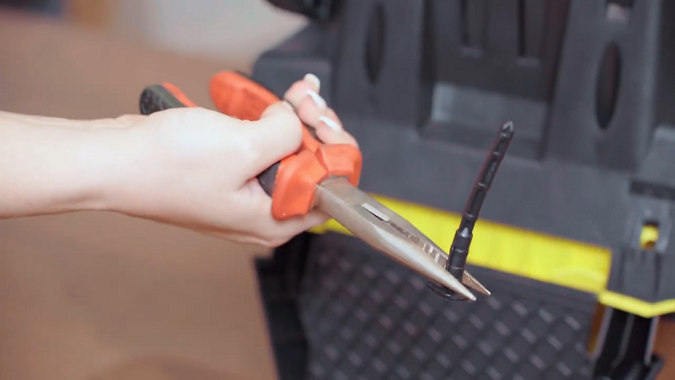Once the lugs have been pulled out a little, use your pin nose pliers to work the lugs all the way out.