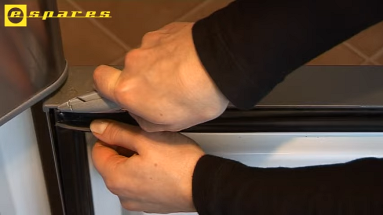 Removing The Old Freezer Door Seal By Cutting Along The Top First With A Stanley Knife